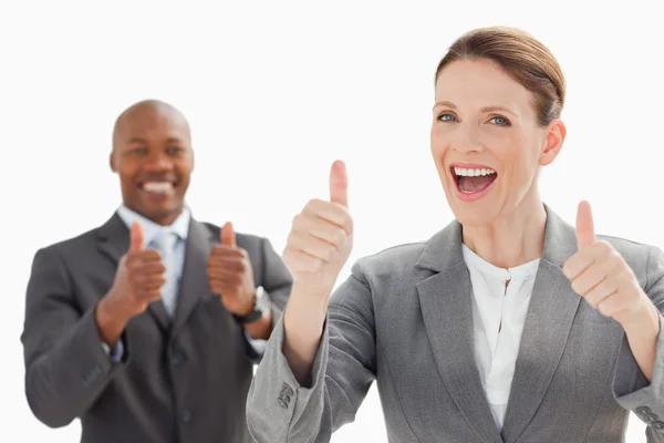 Excited businesspeople with thumbs up — Stock Photo, Image