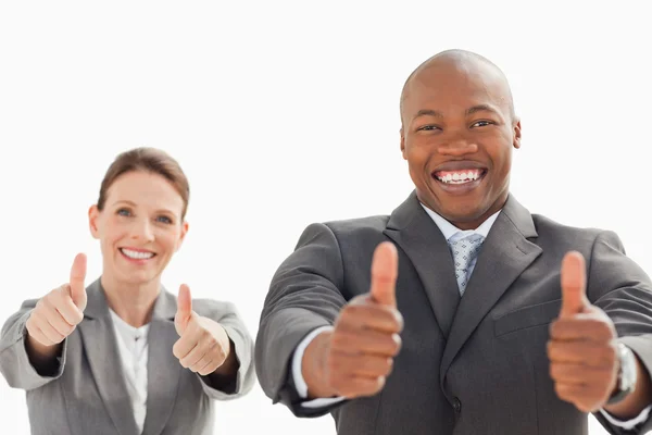 Businessman and woman with their thumbs up — Stock Photo, Image