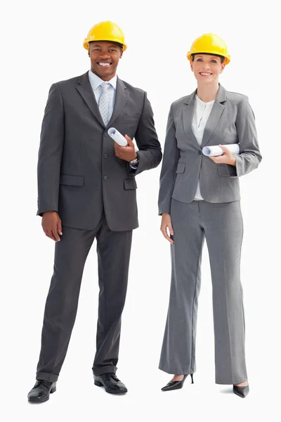 Businesspeople wearing hard hats — Stock Photo, Image