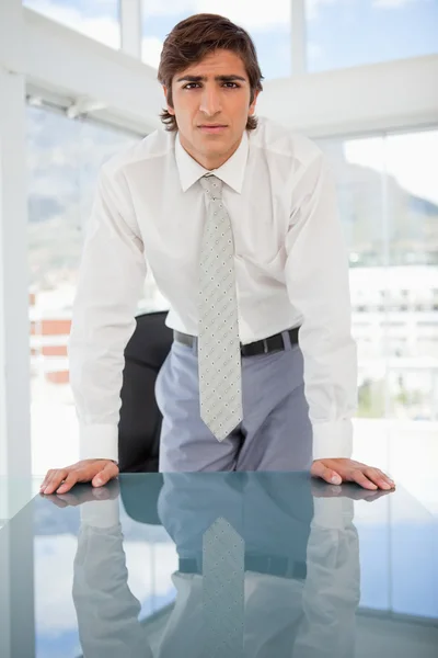 Young serious businessman staring at the camera — Stock Photo, Image