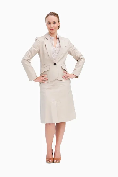 Portrait of a woman in a suit with her hands on her hips — Stock Photo, Image
