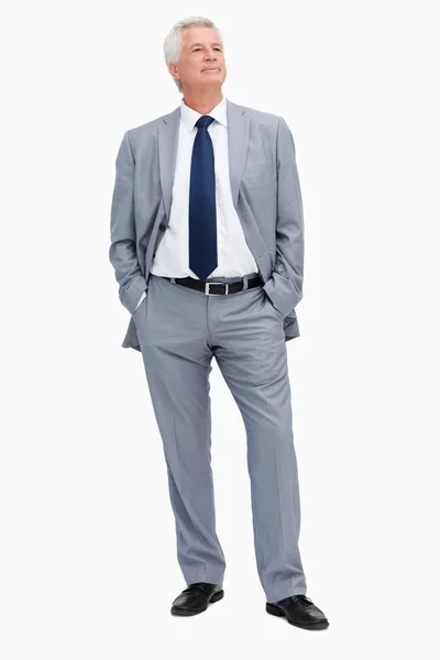 Man in a suit with hands in the pockets — Stock Photo, Image