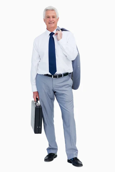 Porträtt av en cool affärsman med en resväska — Stockfoto
