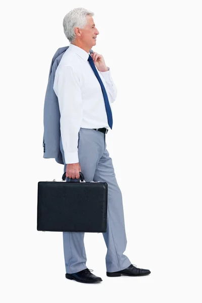 Profil av en cool affärsman med en resväska — Stockfoto
