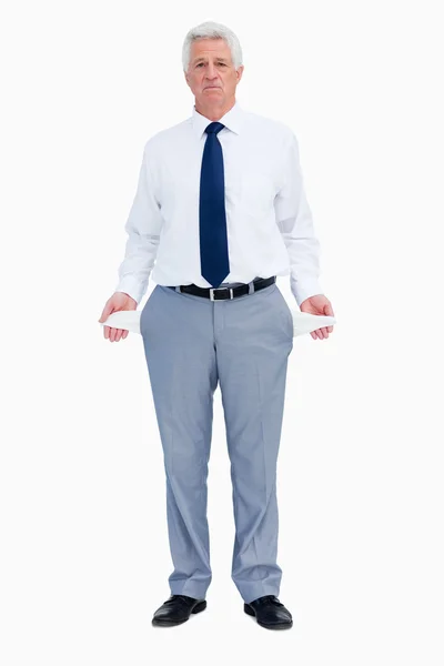 Retrato de un hombre de negocios con bolsillos vacíos — Foto de Stock