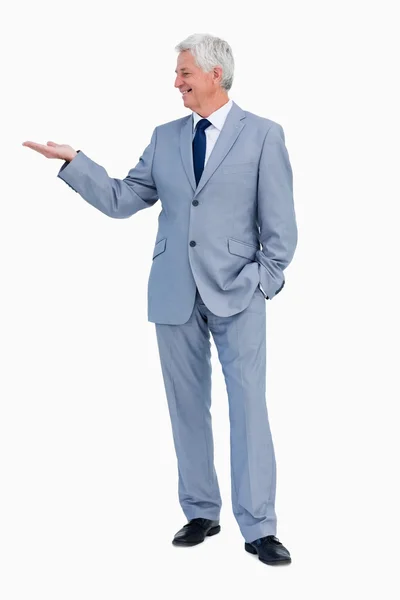 Businessman presenting with hand — Stock Photo, Image