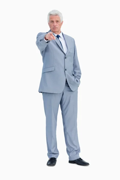 Portrait of a businessman pointing to someone — Stock Photo, Image