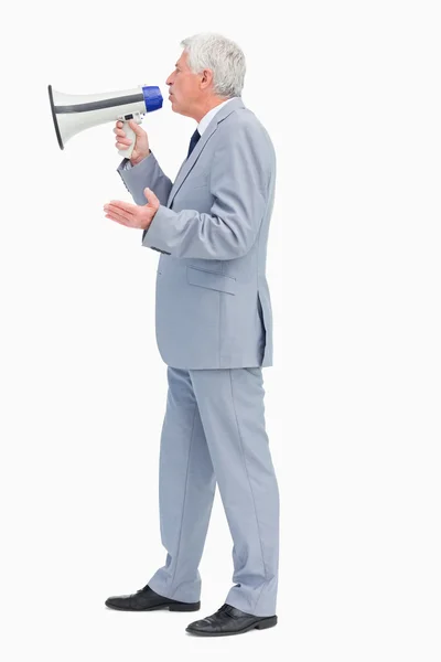 Perfil de un hombre de negocios hablando con megáfono — Foto de Stock