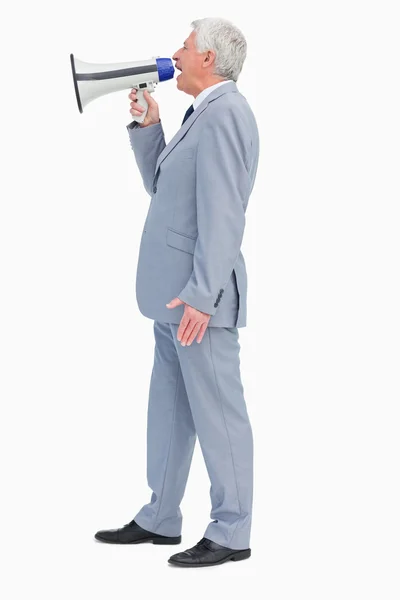 Perfil de um homem de negócios gritando com megafone — Fotografia de Stock