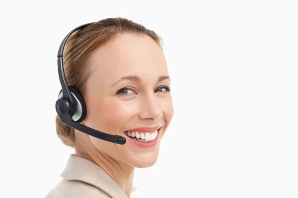Portrait of a woman in a suit with headset — Stock Photo, Image