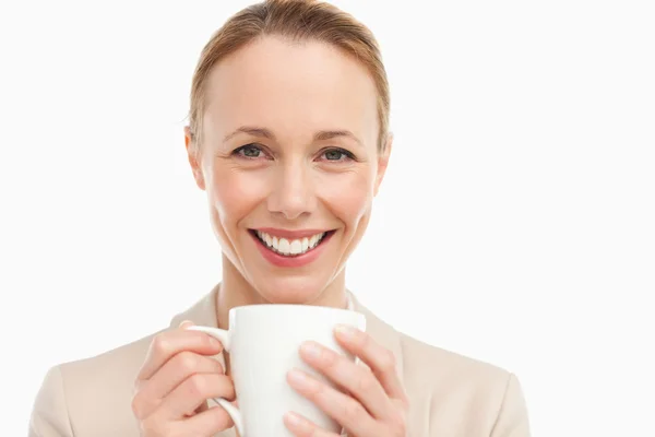 Portrait of a woman in a suit with a mug — Stockfoto