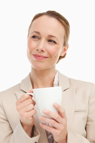 Woman in a suit holding a mug — Stock Photo, Image