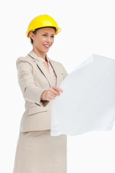 Woman in a suit looking plans — Stock Photo, Image