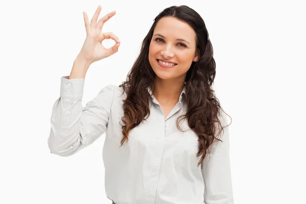 Portrait of a brunette approving with hand — Stock Photo, Image