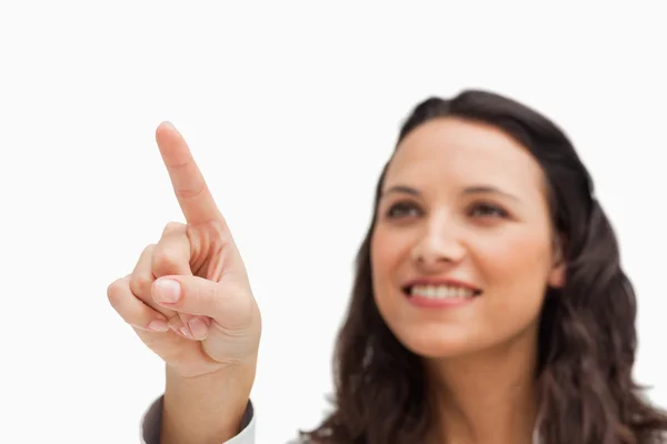 Close-up of a brunette pointing — Stock Photo, Image