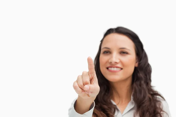 Close-up of a cute brunette pointing — Stock Photo, Image