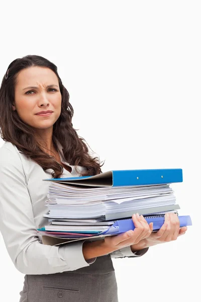 Brunette carrying a lot of files — Stock Photo, Image
