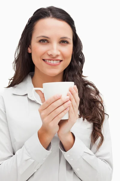 Brunette with a mug — Stock Photo, Image