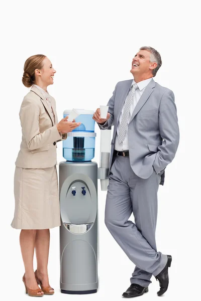 In suit laughing next to the water dispenser — Stock Photo, Image