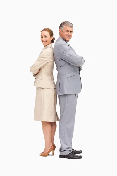 Portrait of smiling business back to back — Stock Photo, Image