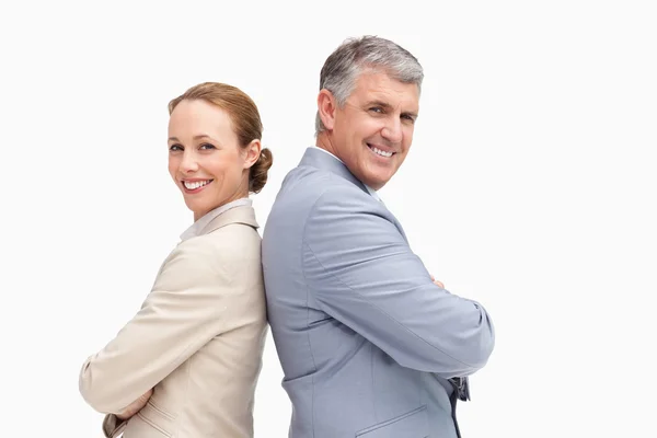 Portrait of happy business back to back — Stock Photo, Image