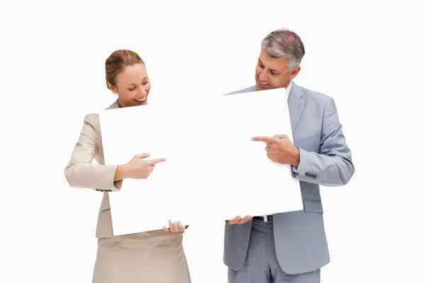 Business holding and pointing a poster — Stock Photo, Image