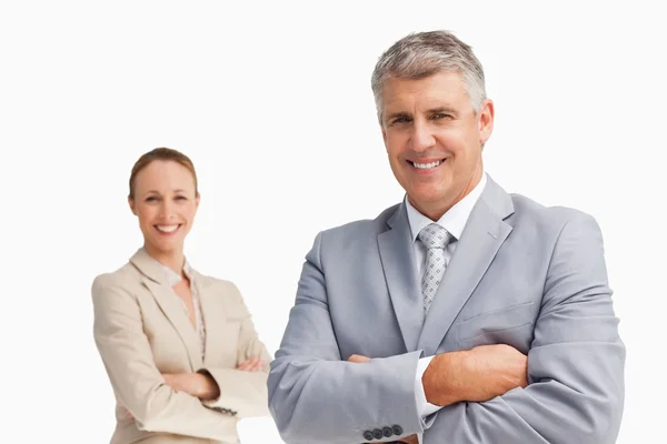 Smiling business with folded arms — Stock Photo, Image