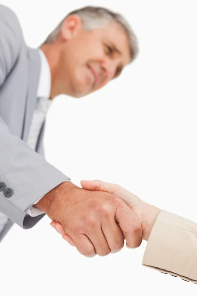 Low angle-shot of shake hands — Stock Photo, Image