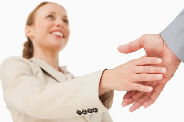 Low angle-shot of a woman shaking hands — Stock Photo, Image