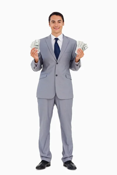 Ritratto di un bell'uomo con un sacco di dollari — Foto Stock