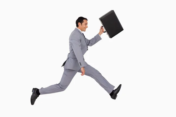 Businessman running with a suitcase — Stock Photo, Image