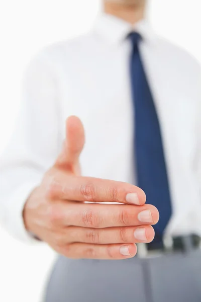 Close-up of a man in a suit giving a hand — Stock Photo, Image