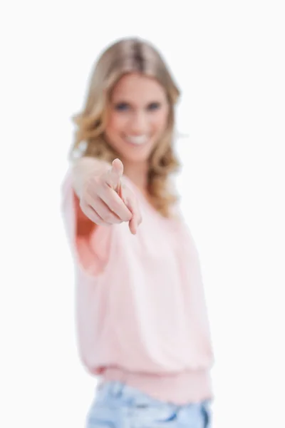 Focus shot of a woman pointing at the camera — Stock Photo, Image