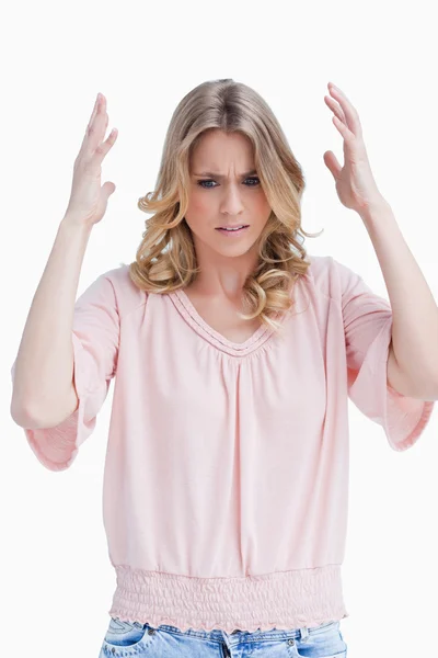 Annoyed woman has her arms held up — Stock Photo, Image