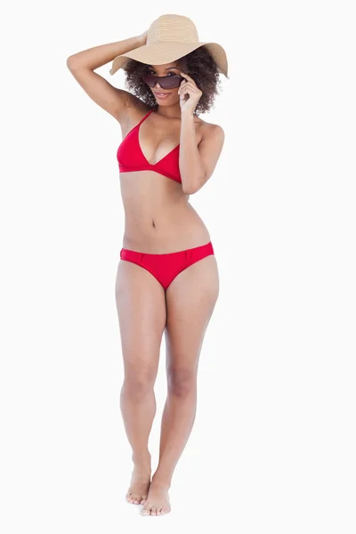 Beautiful woman standing upright in beachwear — Stock Photo, Image