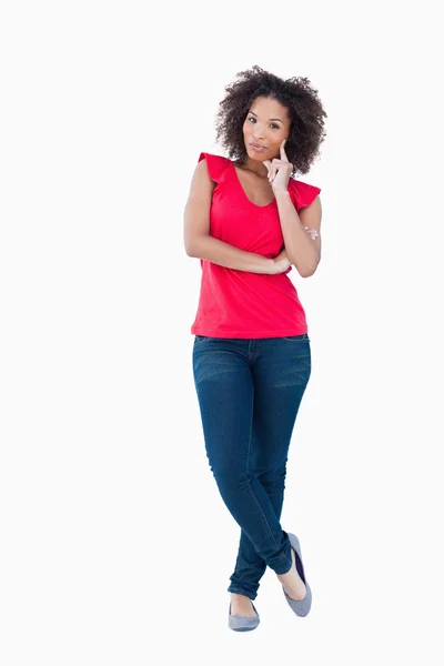 Young thoughtful woman standing upright — Stock Photo, Image