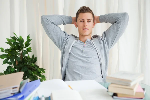 Portrait of a student stretching while looking away — Stock Photo, Image