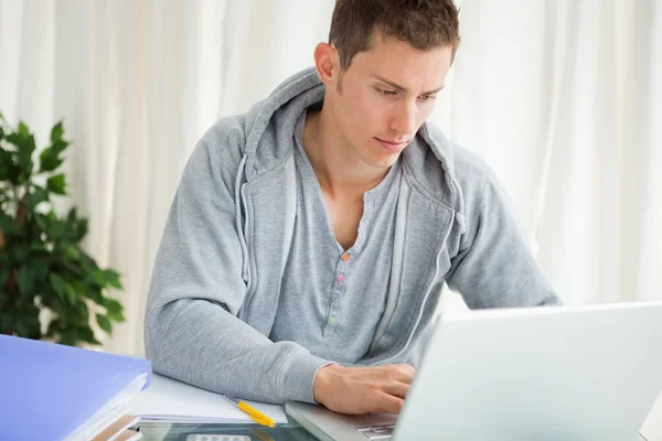 Portrait of a student using a laptop — Stock Photo, Image