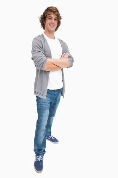 Sorridente studente maschio posa in jeans — Foto Stock