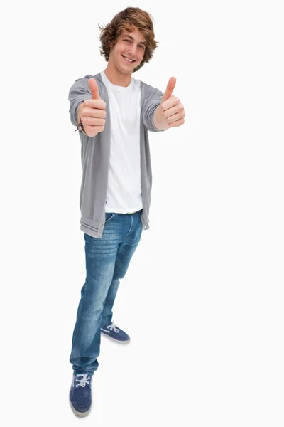 Estudante do sexo masculino feliz o polegar para cima — Fotografia de Stock