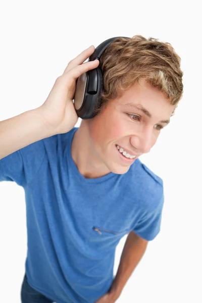 Fisheye view of a blond man wearing headphones — Stock Photo, Image