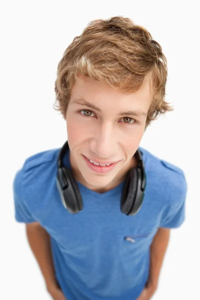 Fisheye view of a blond man with headphones — Stock Photo, Image