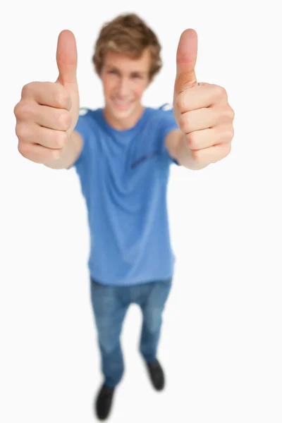 Fisheye view of a male student thumbs-up — Stock Photo, Image