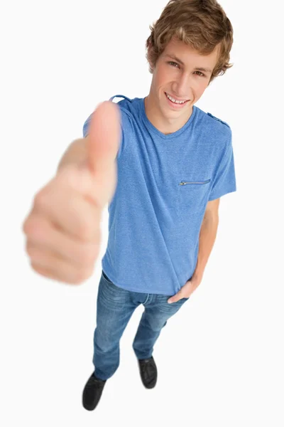Fisheye view of a male student the thumb-up — Stock Photo, Image