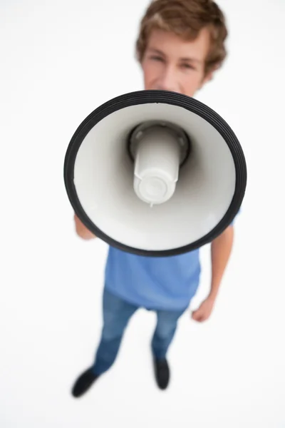 Fisheye view of a megaphone holding by a male student — Stock Photo, Image