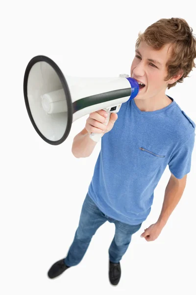 Fisheye view of a male student yelling in a loudspeaker — Stock Photo, Image