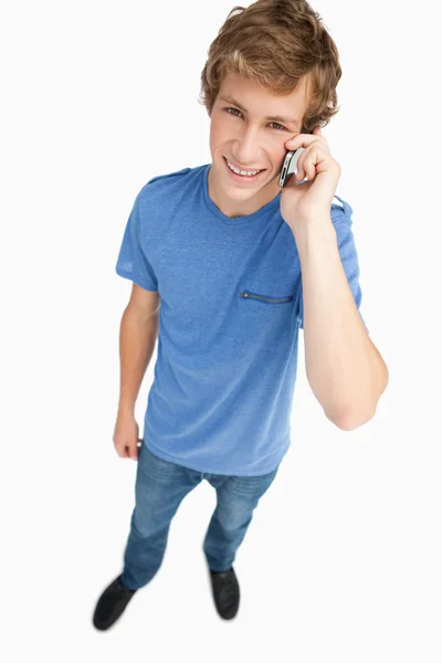 Fisheye view of a male student on the phone — Stock Photo, Image