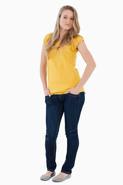 Young woman posing hands in the pockets — Stock Photo, Image