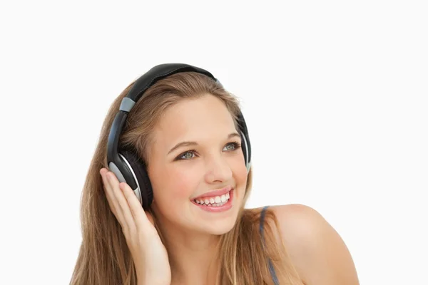 Close-up of a smiling student wearing headphones — Stock Photo, Image