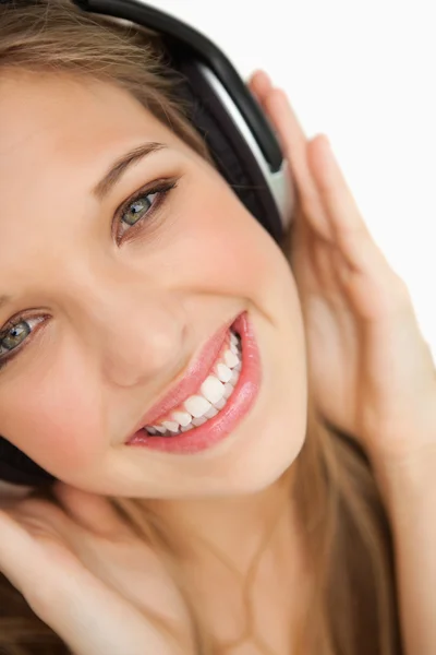 Close-up of a beauty listening to music — Stock Photo, Image